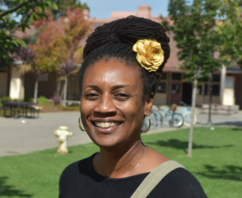 LaDonna Butler smiles for a photo outside of her office at Palo Alto High School. Photo by Daniel Garepis-Holland.