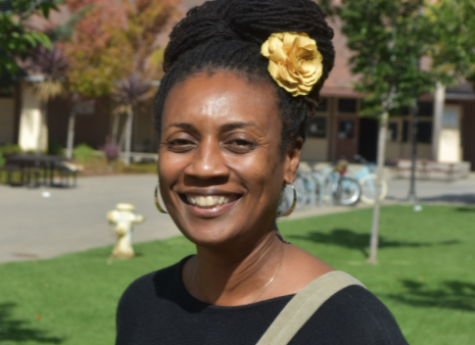 LaDonna Butler smiles for a photo outside of her office at Palo Alto High School. Photo by Daniel Garepis-Holland.