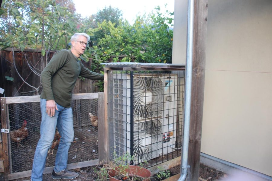 Chemical engineer and environmental activist Sven Thesen points out the various components of the heat pump. Thesen’s home is one of few in Palo Alto that has net zero energy efficiency. “To retrofit is always harder than to build new at the time of construction,” Thesen said. “[Still,] it’s a lot easier than it was a couple years ago.”