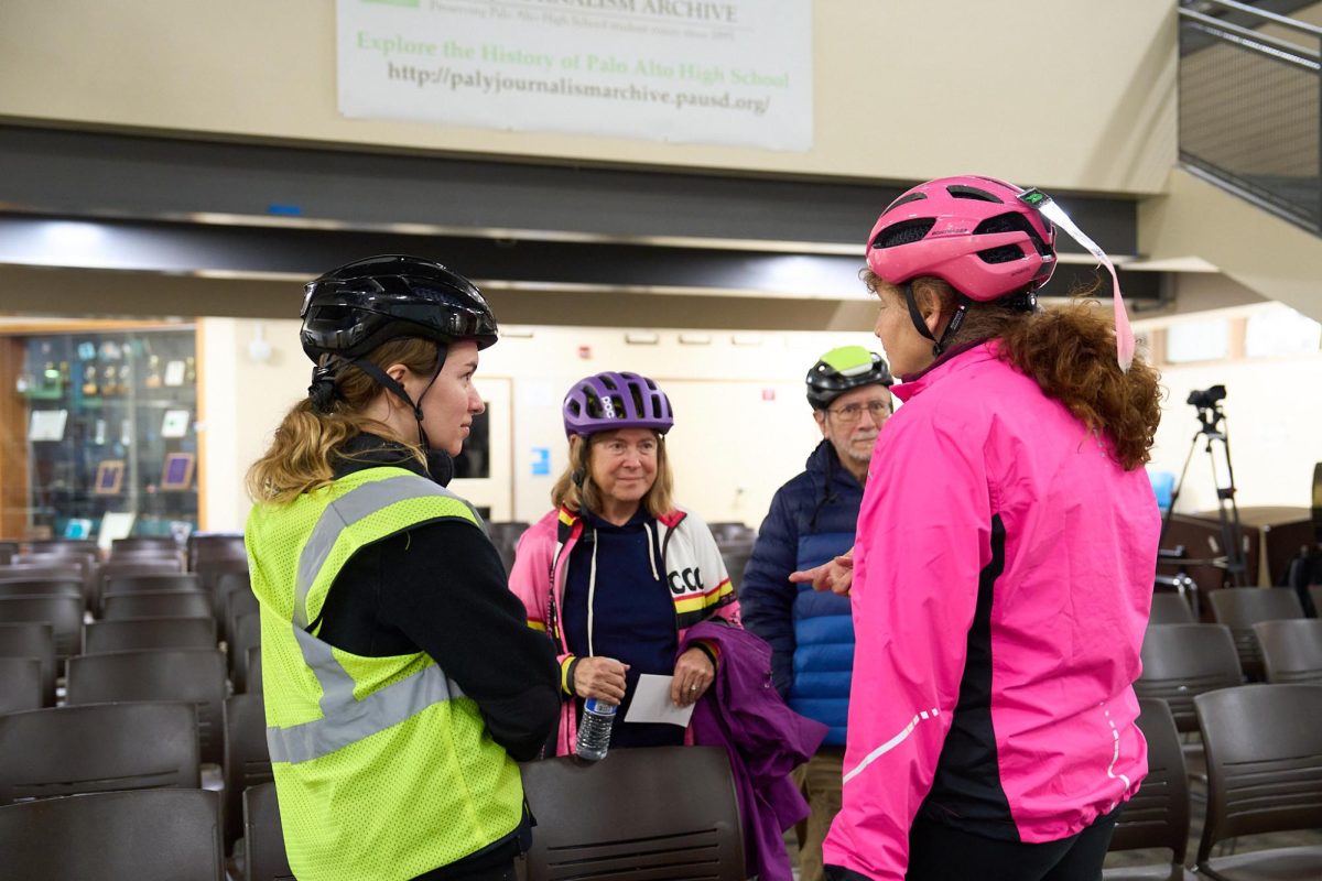 Debbie Baldwin, president of the Sunnyvale Cupertino Cycling Club, talks with fellow cyclists at the Feb. 29 Caltrans community meeting about the El Camino Real bike lane project.