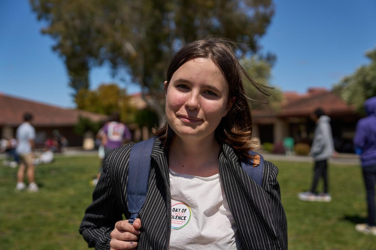 Freshman Darah Katz stands on the Quad along with other Palo Alto High School students on April 12 for the Day of (No) Silence event. “So I know, obviously, we live in a pretty great community,” Katz said. “Theres a lot of other places in the US where it’s a lot worse for LGBTQ people. Ive heard a lot of people here at Paly that use ‘gay’ as an insult and other similar things, and it makes me really uncomfortable.” 