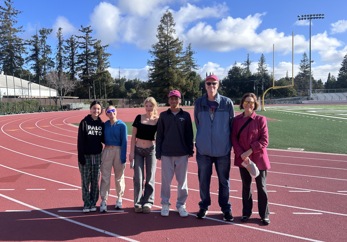 Walking toward change: A group of students and teachers stand on the track after their walk on Monday morning for the Powermoves Club. Through their efforts, they raised close to $4,000 for Los Angeles fire victims. “I know people down there that were up front dealing with the fire,” A.P Seminar and Research teacher, Filippu said. “I was devastated on a personal level”. 
