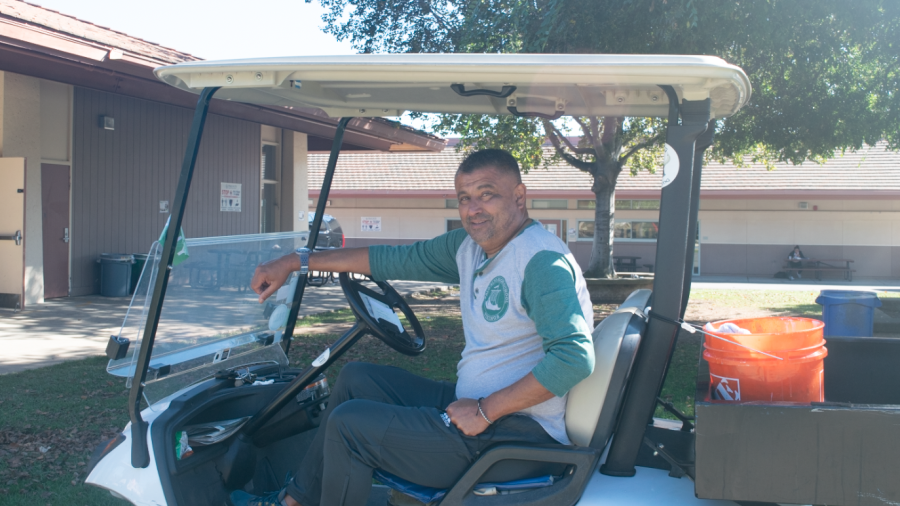 Late Palo Alto High School Campus Supervisor Ernesto Cruz sits in his golf cart.