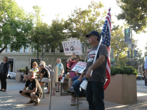 RALLYING FOR PEACE
Community members gather in Downtown Palo Alto at a Stand Up For Science and Sanity rally.