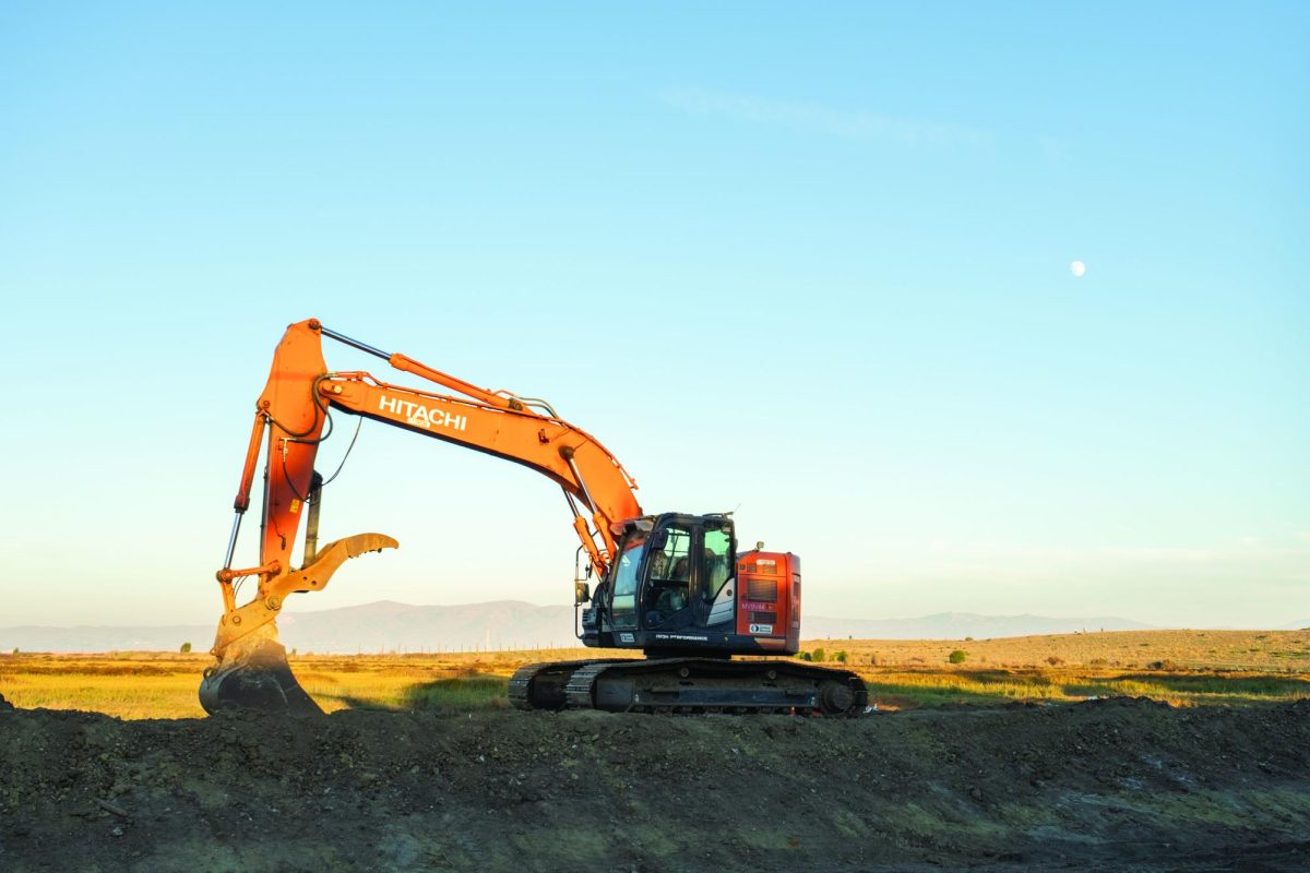 DIGGING AWAY ­— An excavator being used to construct the levee sits dormant along the end of Embarcadero Road in Palo Alto’s Baylands Nature Preserve.
