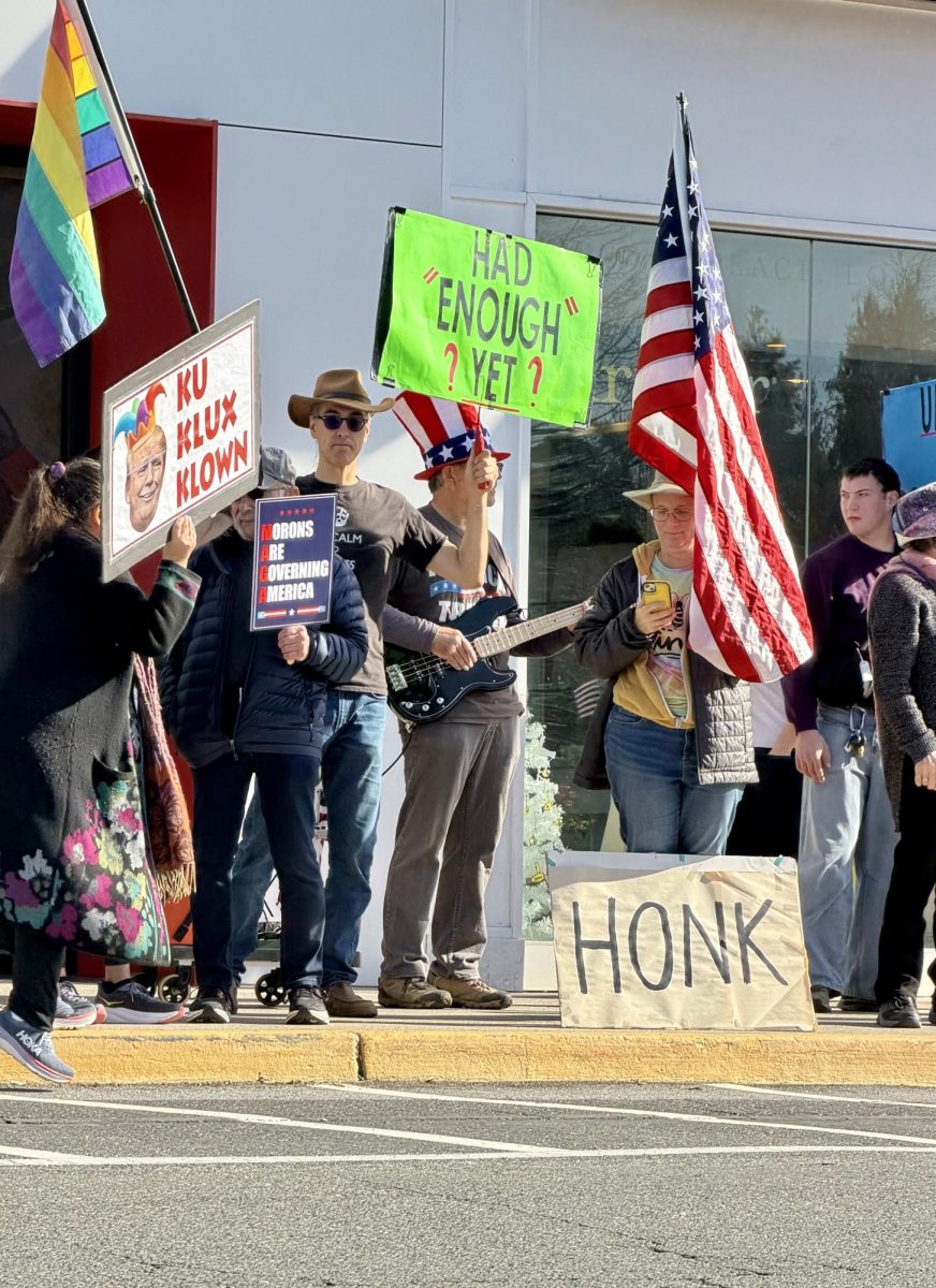 Democracy on display — Protestors demonstrate outside the Stanford Shopping Center on Jan. 10 against the Trump administration. The rally focused on immigration, foreign policy and economic concerns. “I'm just a normal goofball, tax-paying US citizen who's looking at all of this stuff, and I'm outraged that my tax dollars are being used to arm thugs that shoot unarmed citizens,” said Scott Hersher, founder of The Wolves, a self-proclaimed independent progressive group based in Menlo Park.