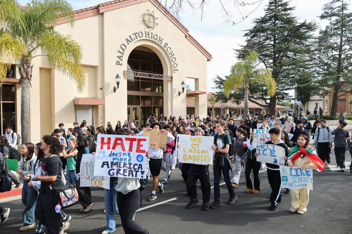 Palo Alto High School students cheer as they depart the Performing Arts Center on Friday at noon, towards El Camino Real. Many are holding anti-ICE signs with phrases like “Melt ICE,” “We love Latina Baddies,” and “Hate doesn’t make America Great,” created during lunch on Thursday. According to junior Aiden Miao, he joined the march with classmates to make a statement.  “We’re just trying to join the national movement to protest ICE,” Miao said. “Just the sheer amount of people here really goes to show how many people care about this.” 