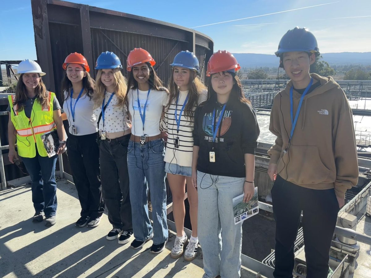 The Youth Climate Advisory Board’s members (right to left: Aiden Miao, Alida Cuttriss, Anika Agrawal, Elsa Lagerblad, Jenna Mu) meet with City Worker Tina Keegan (left) to observe a wastewater treatment facility during a tour. During the visit, the members learned about sustainable wastewater management and provided feedback on making the tours more accessible to youth. “We toured the wastewater treatment plant, learned about biosolid processing and roles of public and business in environmental engineering careers, and provided feedback on how to make ongoing tours more accessible and engaging to youth and the general public,” Yoon said. (Photo Courtesy of Kiara Yoon)