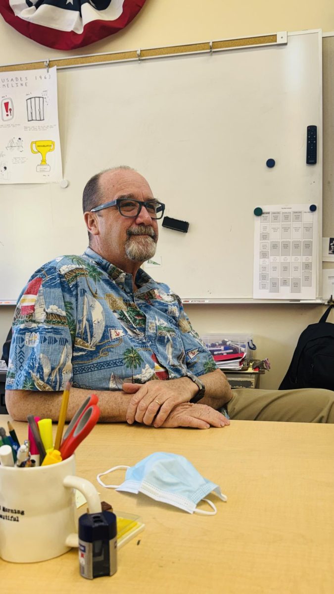 SCOUTING FOR THE FUTURE - Social Justice Pathway co-founder Eric Bloom sits at his desk in room 805. Bloom said his experience both in Boy Scouts and as a teen leader gave him insight into how adults can facilitate teen leadership. “The part about Boy Scouts that makes it so successful … is that it’s so driven by the individual troop,” Bloom said. “It’s [all] up to you.”