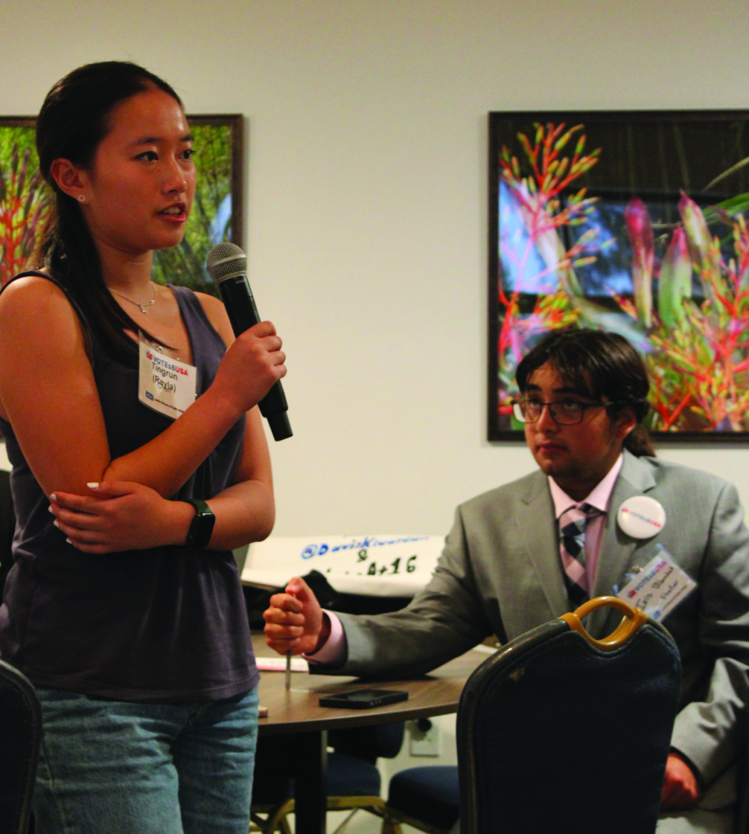 SPREADING INFLUENCE — Vote 16 Palo Alto co-president Rayla Chen speaks at the Vote16USA National Convening in August. President and Vote 16 Palo Alto co-founder Iris Blanchet sits in the background. “Vote 16 is an organization that aims to promote civic engagement through lowering the voting age,” Chen
said. “It’s really important that civics gets passed ... from generation to generation." 